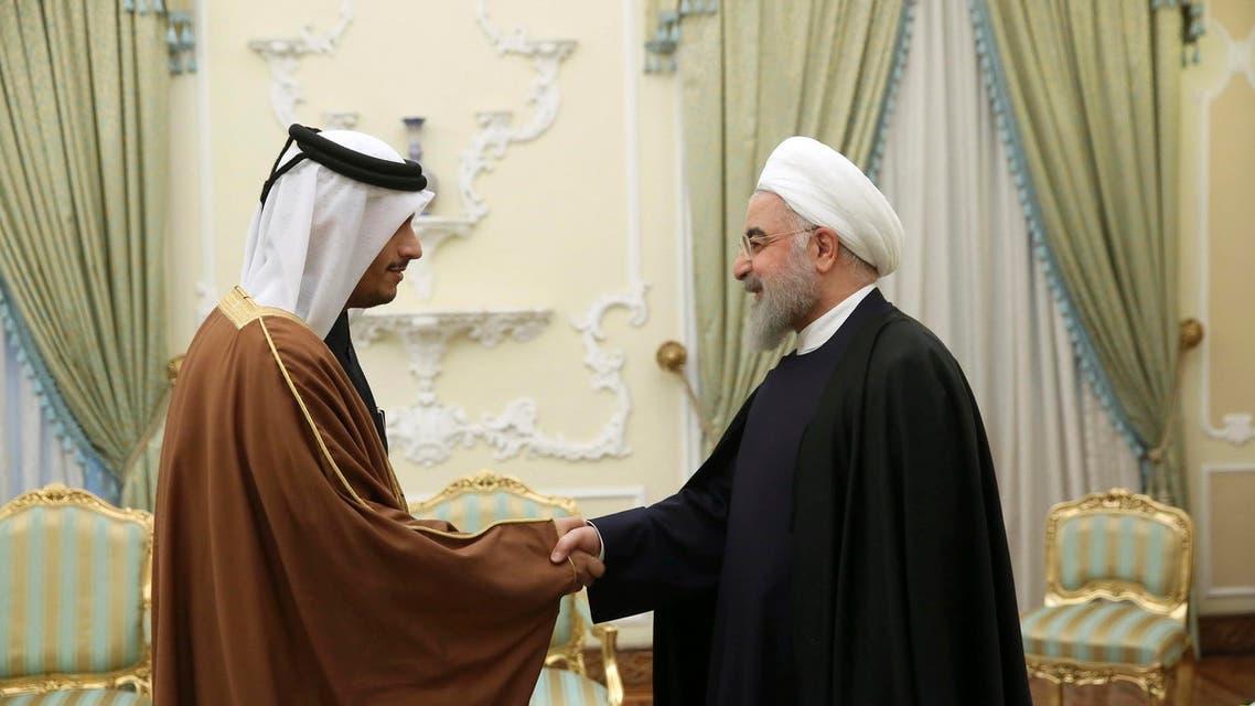 In this photo released by the official website of the office of the Iranian Presidency, President Hassan Rouhani, right, welcomes Qatari Foreign Minister Sheikh Mohammed bin Abdulrahman Al Thani for their meeting in Tehran, Iran, Saturday, Jan. 4, 2020. (AP)