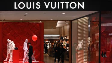 Staff members are seen in a Louis Vuitton store in the Times Square shopping mall in the Causeway Bay district of Hong Kong on January 4, 2020. Luxury brand Louis Vuitton is closing a major store in high-end Hong Kong shopping centre Times Square often targeted by democracy protesters, local media reported.