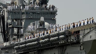 Sailors and Marines stand on the deck of the USS Bataan (LHD 5) as it arrives into Pier 88 during the "Parade of Ships" ceremony to kick off Fleet Week in New York. (File photo: AFP)