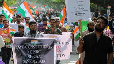 Indians hold placards as they march during a protest against a new citizenship law that opponents say threatens India's secular identity in Hyderabad, India. (AP)