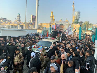 Mourners surround a car carrying the coffin of slain Iranian IRGC Commander Qassem Soleimani during a funeral procession in Kadhimiya, Baghdad, on January 4, 2020. (Photo: AFP)