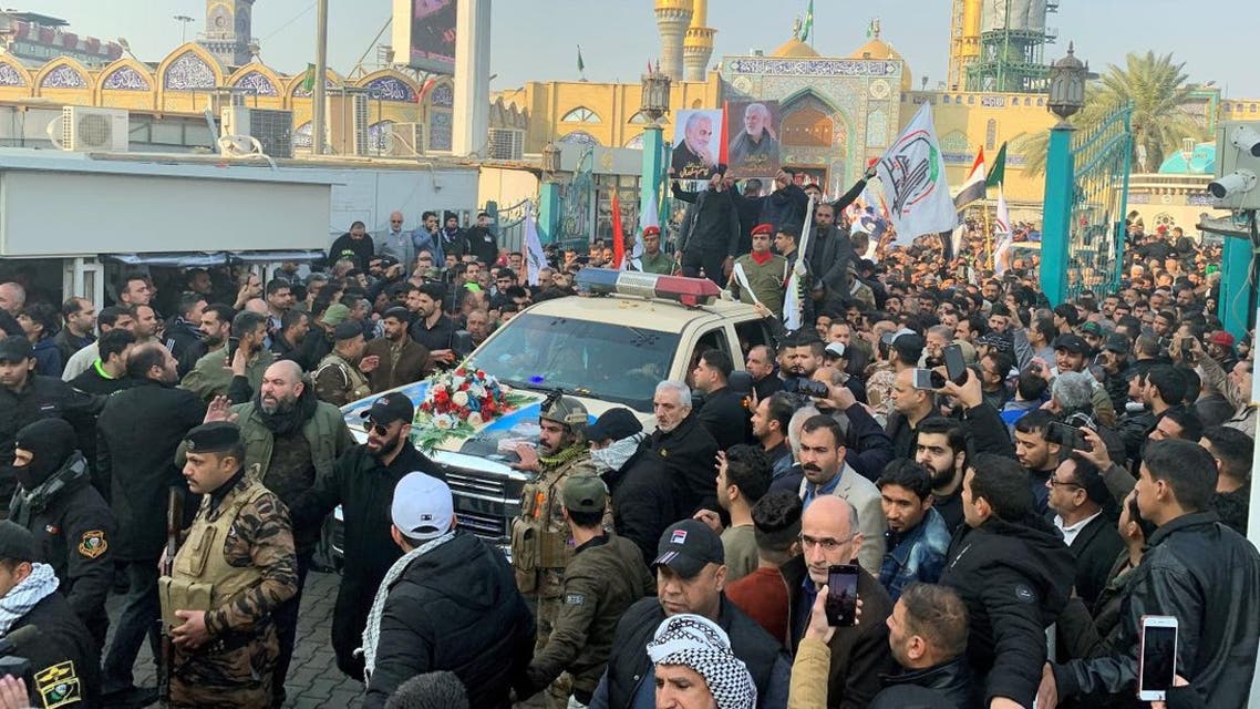 Mourners surround a car carrying the coffin of slain Iranian IRGC Commander Qassem Soleimani during a funeral procession in Kadhimiya, Baghdad, on January 4, 2020. (Photo: AFP)