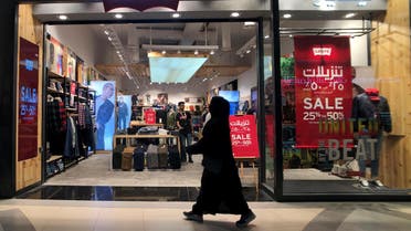 Dhahran, Saudi Arabia A Saudi woman walks in front of the famous American jeans brand outlet Levi's in the Mall of Dhahran, Saudi Arabia, December 17, 2018. Picture taken December 17, 2018. REUTERS/Hamad I Mohammed