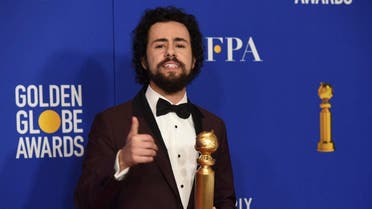 Ramy Youssef poses in the press room with the award for best performance by an actor in a television series, musical or comedy. (AP)