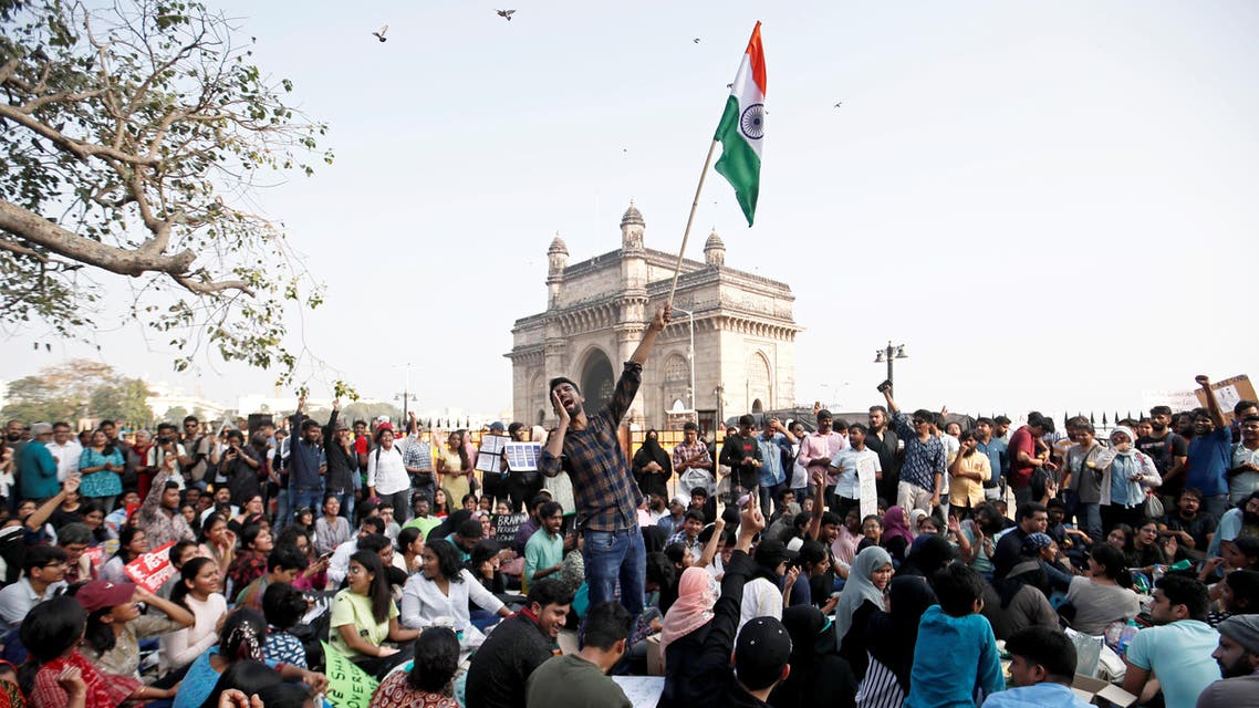 Demonstrators attend a protest against attacks on the students of New Delhi's Jawaharlal Nehru University (JNU), outside the Gateway of India monument in Mumbai, India. (Reuters)