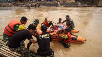 Indonesia braces for more downpours as flood toll hits 66