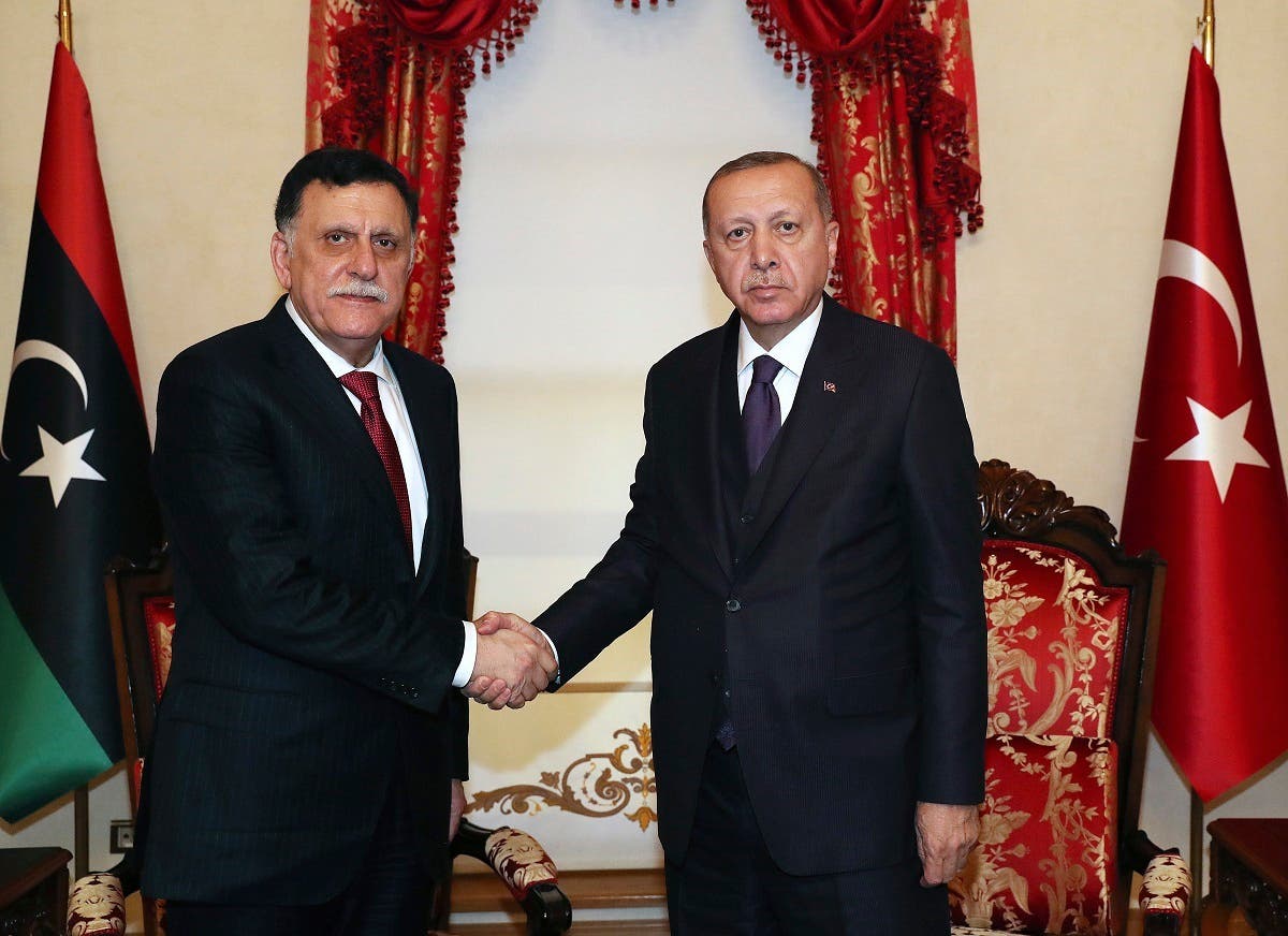 Turkey’s President Recep Tayyip Erdogan shakes hands with Fayez al Sarraj, prior to their talks in Istanbul, Sunday, Dec. 15, 2019. (AP)