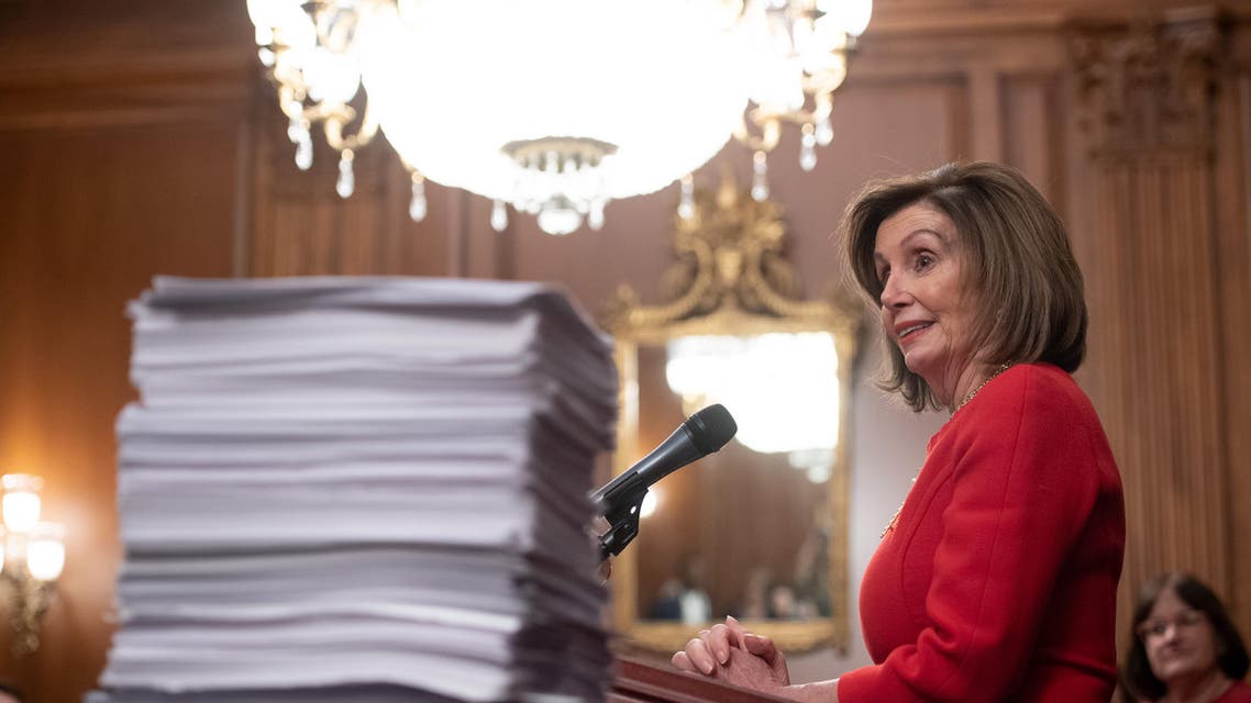US Speaker of the House Nancy Pelosi speaks alongside a stack of legislation at the US Capitol in Washington, DC, December 19, 2019. (File photo: AFP)