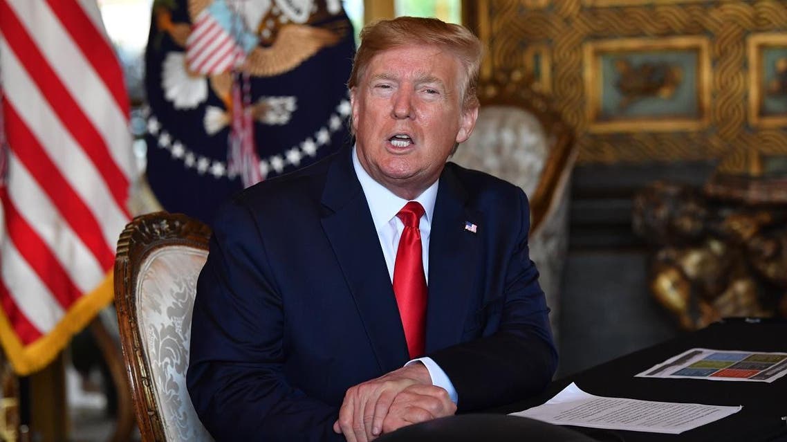 In this file photo taken on December 24, 2019, US President Donald Trump answers questions from reporters at the Mar-a-Lago estate in Palm Beach, Florida. (AFP)