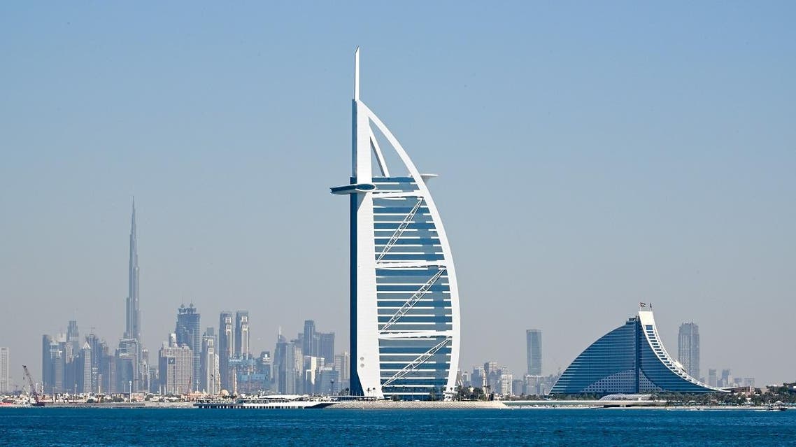 A picture taken on December 25, 2019 shows the skyline of Dubai with Burj Al Arab (R) and Burj Khalifa(L), the world’s tallest building. (AFP)