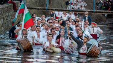 Bulgarians sing, play bagpipes and chain dance in icy waters during Epiphany in Kalofer on Jan. 6, 2020. (Photo: AP)