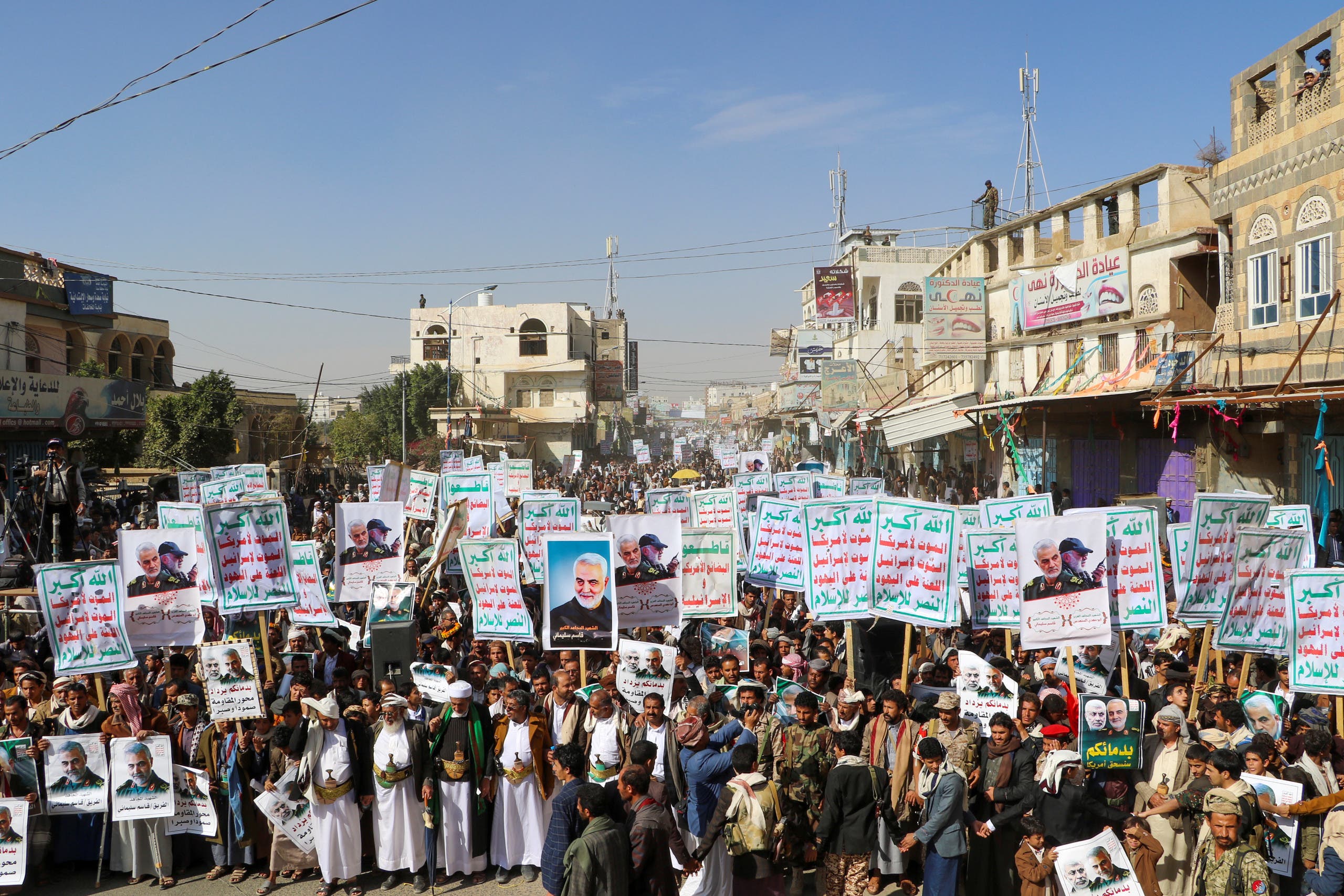 Supporters of the Houthis hold placards that read: "God is the Greatest, Death to America, Death to Israel, Curse on the Jews, Victory to Islam" in Saada, Yemen January 6, 2020. (Reuters)