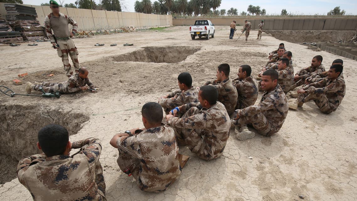 A soldier from the French Foreign Legion oversees training of members of the Iraqi Counter Terrorism Service to sweep for and dismantle improvised explosive devices (IEDs), in Baghdad International Airport on March 19, 2018.