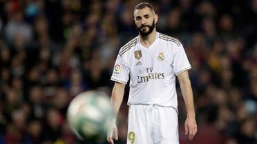 Real Madrid's Karim Benzema looks at the ball during a Spanish La Liga soccer match between Barcelona and Real Madrid at Camp Nou stadium in Barcelona, Spain, Wednesday, Dec. 18, 2019. (AP)
