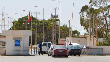 Vehicles cross the Tunisian-Libyan border of Ras Jedir on May 14, 2016. Tunisian and Libyan authorities have reached a deal to lift a trade blockade at their main border crossing, officials said after angry street protests. The breakthrough came after an agreement was reached late Friday related to customs duties for goods passing through Ras Jedir, local governor Tahar Matmati said.