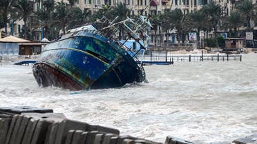 A picture taken on January 19, 2018 shows waves breaking against the hull of a ship on the shore of the Egyptian port city of Alexandria during the annual winter storm. (File photo: AFP)