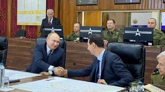 Russia’s Putin makes rare visit to Syria, meets Assad