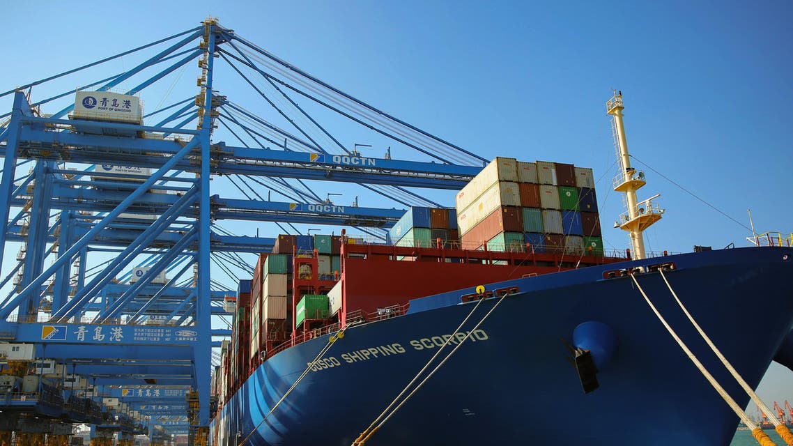 This photo taken on November 28, 2019 shows a cargo ship loaded with containers at an automatic dock in Qingdao in China's eastern Shandong province. The second phase of the automatic dock at the Qingdao port was put into operation on November 28. (AFP)