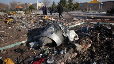Rescue teams work amidst debris after a Ukrainian plane carrying 176 passengers crashed near Imam Khomeini airport in the Iranian capital Tehran early in the morning on January 8, 2020. (AFP)