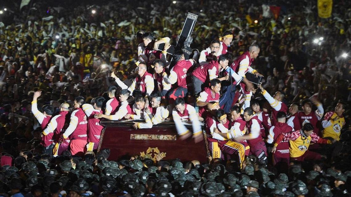 Thousands of devotees follow the carriage with the statue of the Black Nazarene at the start of an annual religious procession in Manila. (AFP)