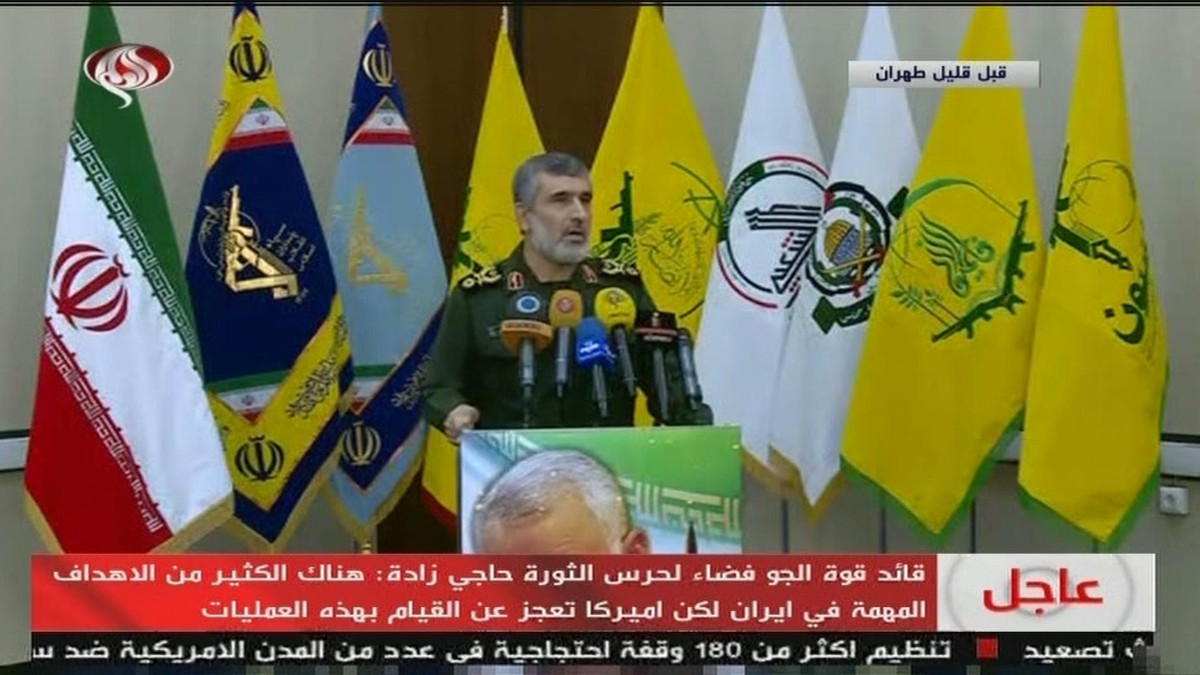 IRGC airforce commander Amir Ali Hajizadeh in front of proxy flags Iran on state TV, Jan 9 - Screengrab from Twitter