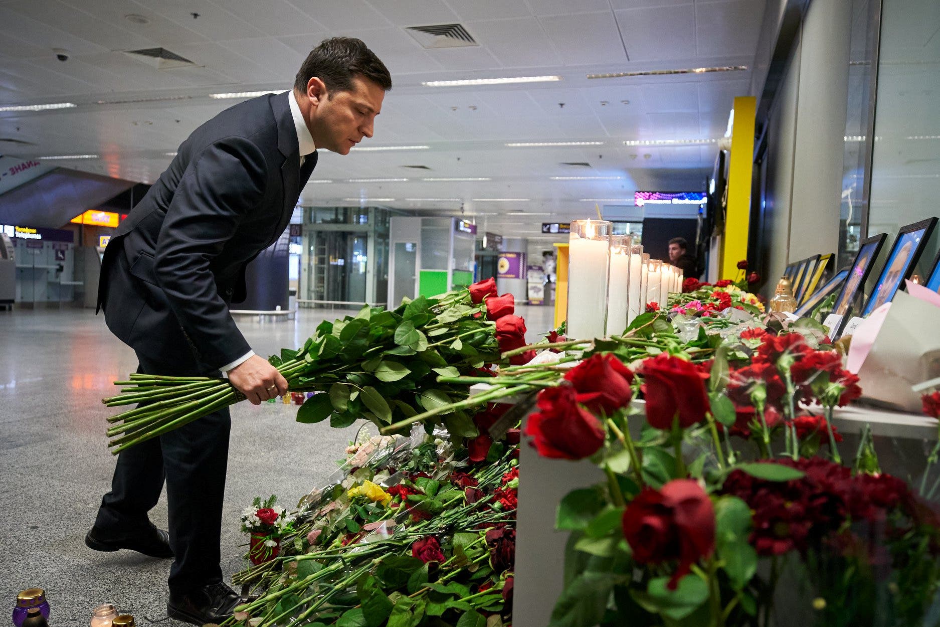 Ukrainian President Volodymyr Zelenskiy lays flowers to commemorate victims of the Ukraine International Airlines Boeing 737-800 plane crash, at a memorial in Boryspil International airport outside Kiev, Ukraine, on January 9, 2020. (Reuters)