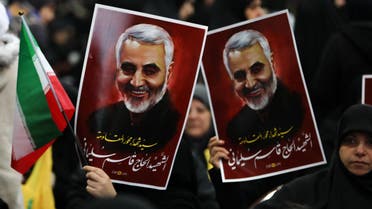 Supporters of the Shia Hezbollah movement hold posters of slain Iranian major general Qasem Soleimani, January 5, 2020. (AFP)