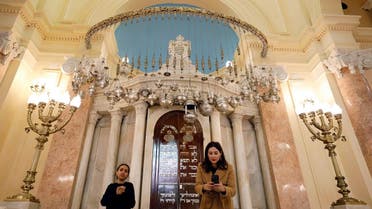 People stand in front of bima inside the Eliyahu Hanavi Synagogue during its reopening after the completion of a restoration project in Alexandria, Egypt. (Reuters)