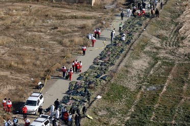 Bodies of the victims of a Ukrainian plane crash are collected by rescue team at the scene of the crash in Shahedshahr, southwest of the capital Tehran, Iran. (AP)