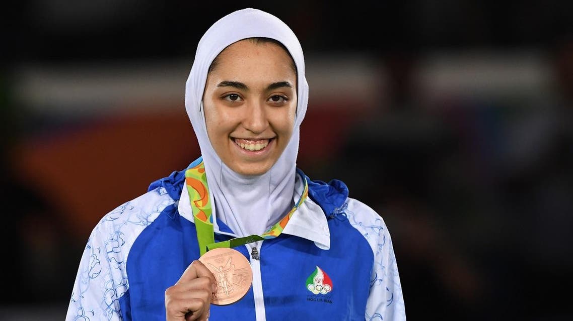 Iran’s Kimia Alizadeh Zenoorin poses with her bronze medal on the podium after the women’s taekwondo event in the -57kg category as part of the Rio 2016 Olympic Games, on August 18, 2016, at the Carioca Arena 3, in Rio de Janeiro.(AFP)