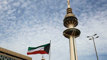 Kuwait's Liberation Tower is seen near a Kuwaiti flag in Kuwait City, Kuwait. (AP)