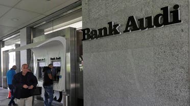 People use automatic teller machines (ATM) at Bank Audi in the centre of the Lebanese capital Beirut on November 19, 2019. (File photo: AFP)