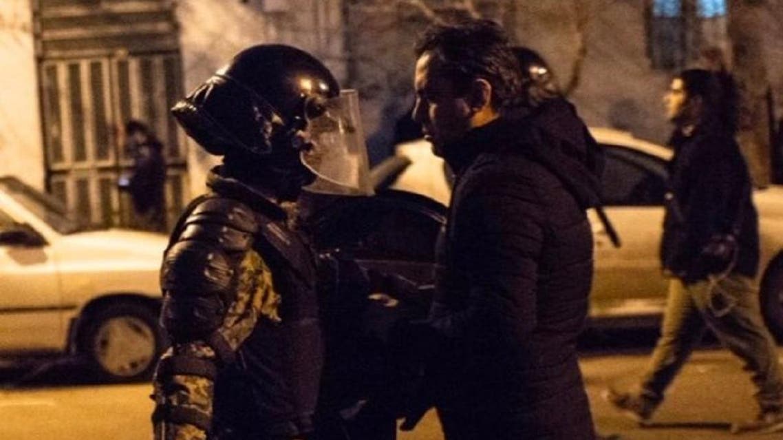 A photo taken on January 12, 2020 during protests in Iran shows a protester coming face to face with a police officer. (PhotoL: Twitter)