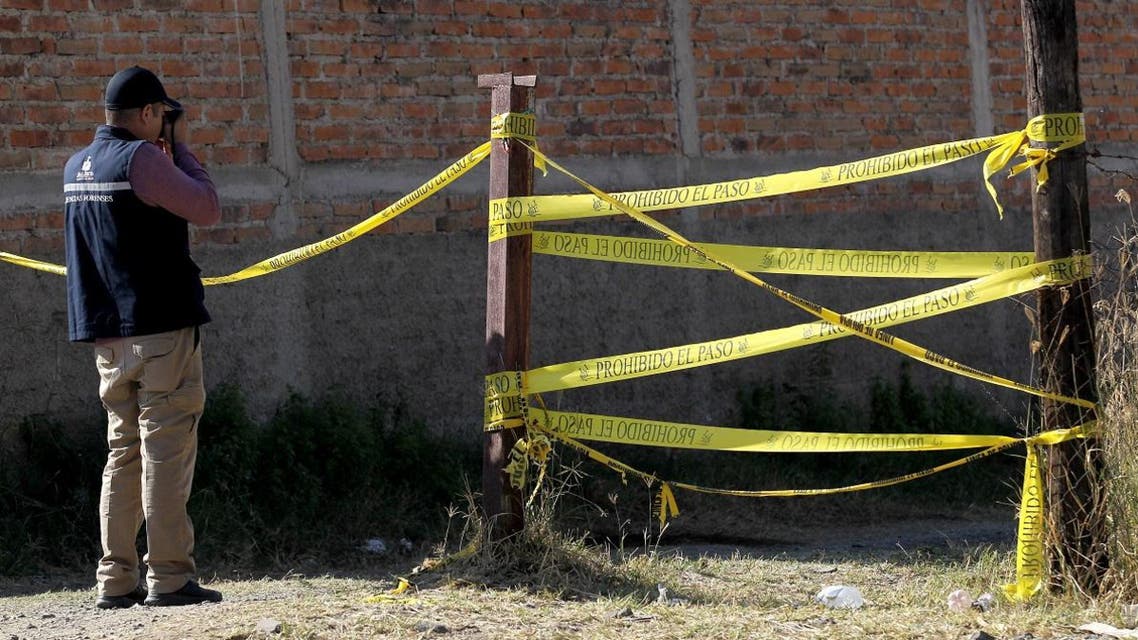 Personnel of Jalisco's Forensic Institute works at the site where a clandestine mass grave was discovered in Jalisco State, Mexico, on January 13, 2020. (Photo: AFP)