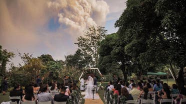 Picture depicting a Filipino couple getting married in-front of the live Taal volcano. (via Twitter)