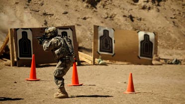 In this photo taken Thursday, March 17, 2011, a U.S. Army soldier from A Co., 1st Battalion, 18th Infantry Regiment, 2nd Brigade, 1st Infantry Division fires his weapon at a range at Camp Taji, north of Baghdad. (File photo: AP)