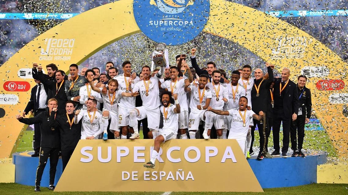 Real Madrid's players celebrate after winning the Spanish Super Cup final between Real Madrid and Atletico Madrid on January 12, 2020, at the King Abdullah Sports City in the Saudi Arabian port city of Jeddah. (AFP)