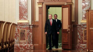 Russian President Putin and Prime Minister Medvedev attend a meeting with members of the government in Moscow. (Reuters)