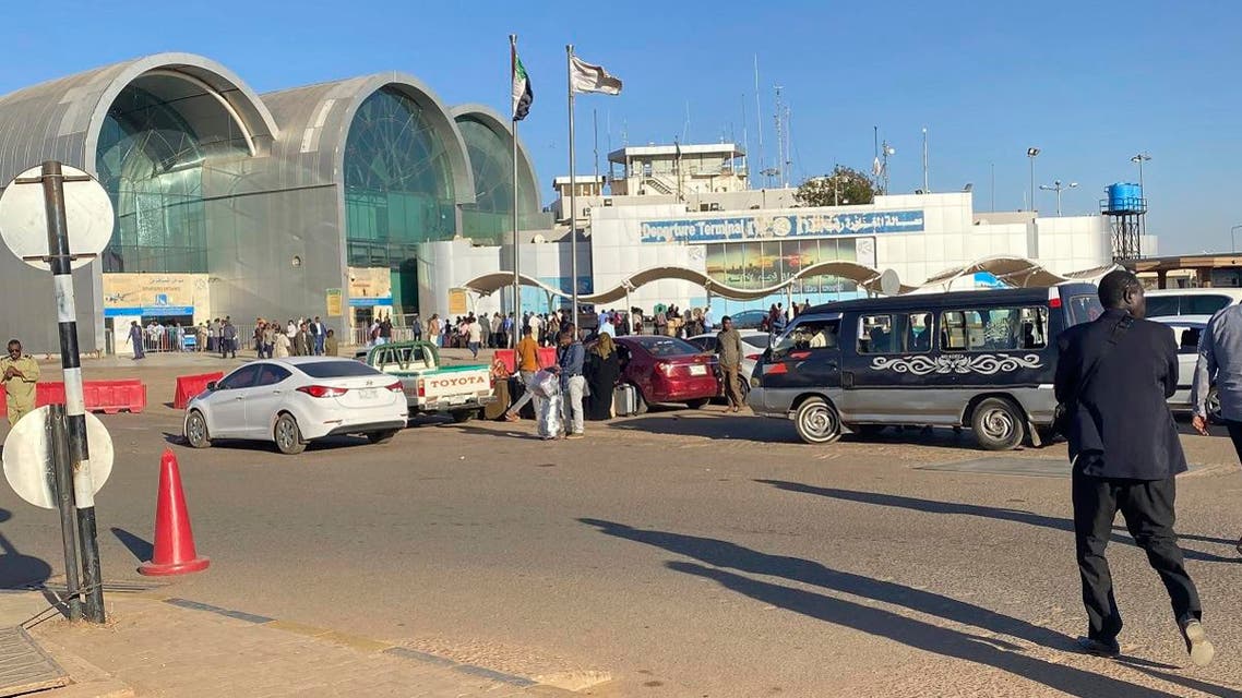 People wait outside Khartoum International Airport, in Khartoum, Sudan. (Reuters)