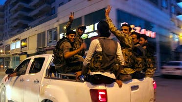 This Friday, Oct. 11, 2019 file photo, Turkish-backed Syrian opposition fighters from the Syrian National Army, flash the V-sign as they are driven through the town of Akcakale, Sanliurfa province, southeastern Turkey. (File photo: AP)
