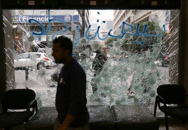 A man stands near a broken facade of a bank in Beirut, Lebanon, January 15, 2020. (Photo: Reuters)
