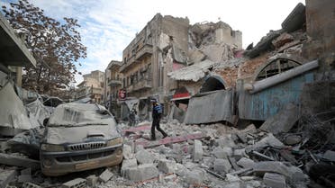 A Syrian walks on the rubble of a building following an air strike on Idlib on January 15, 2020. (AFP)