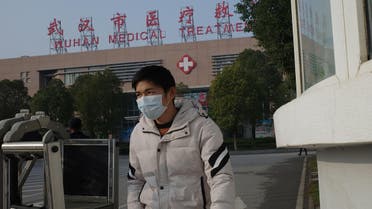 A man leaves the Wuhan Medical Treatment Centre, where a man who died from a respiratory illness was confined, in the city of Wuhan, Hubei province, on January 12, 2020. (AFP)