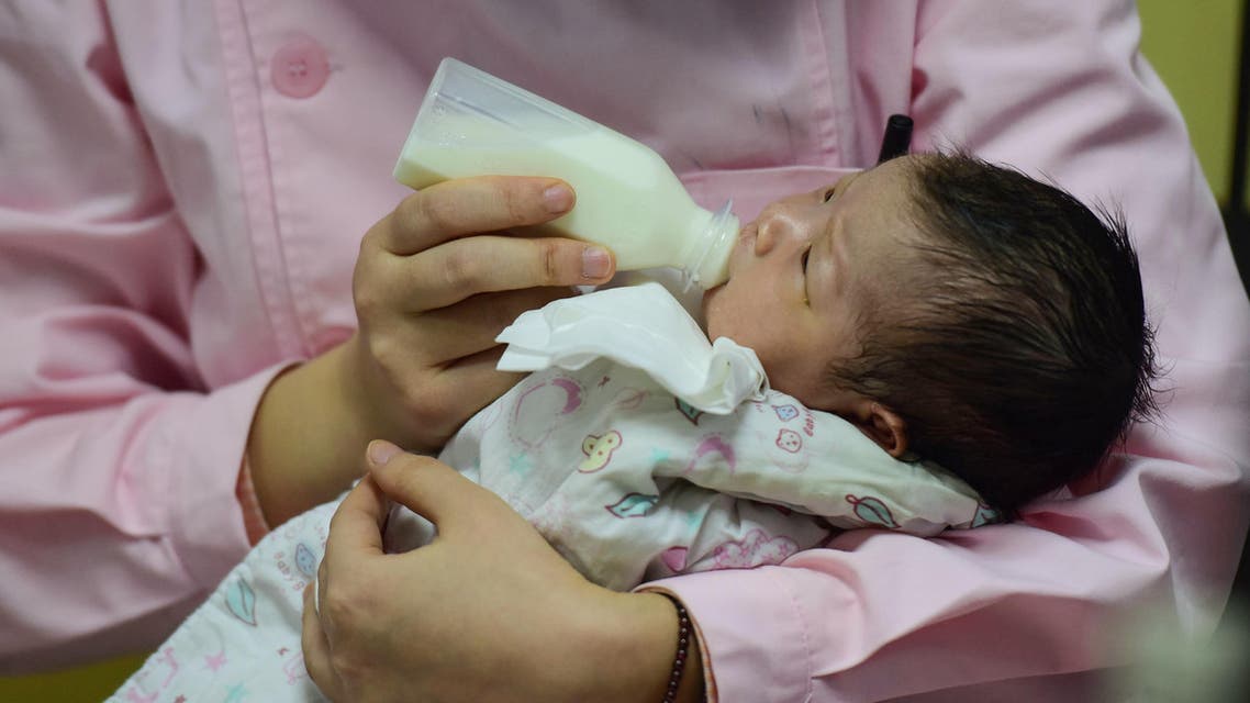 This photo taken on January 19, 2019 shows a medical staff taking care of a new born baby at a hospital in Fuyang in China's eastern Anhui province. (AFP)