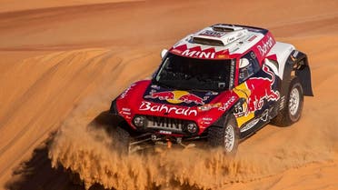 Driver Carlos Sainz, of Spain, and co-driver Lucas Cruz, of Spain, race their Mini during stage eleven of the Dakar Rally between Shubaytah and Haradth, Saudi Arabia, Thursday, Jan. 16, 2020. (AP)