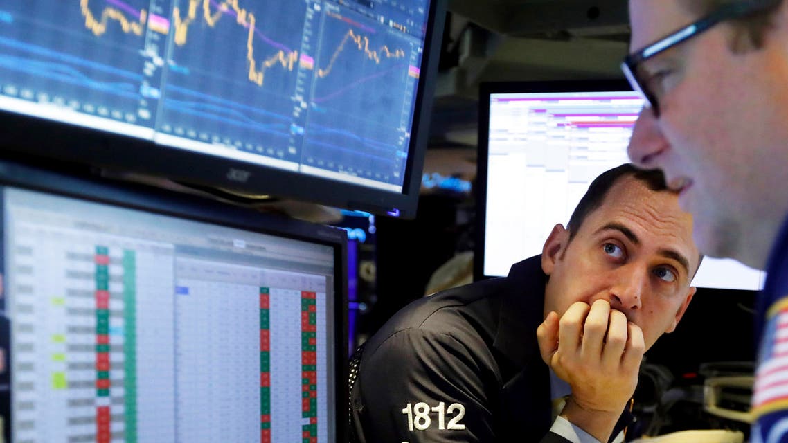 In this Nov. 14, 2019, file photo a pair of specialists work on the floor of the New York Stock Exchange. (AP)