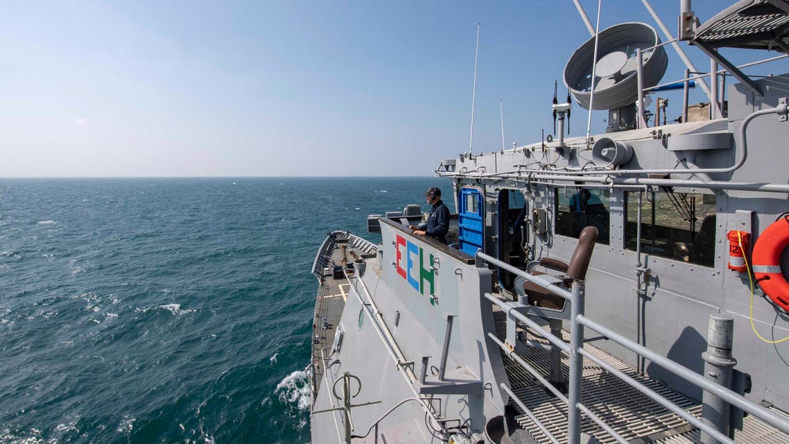 U.S. Navy, Ensign Sylvie Debrosse stands watch on the bridge of the Ticonderoga-class guided-missile cruiser USS Chancellorsville (CG 62) as it transits the Taiwan Strait. (AP)
