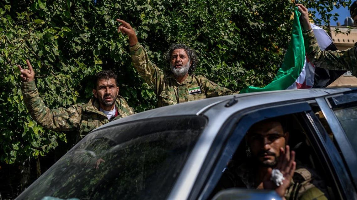 Turkey-backed Syrian opposition fighters going to Tal Abyad from Turkish gate towards Syria in Akcakale in Sanliurfa province. (AFP)