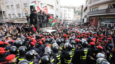 Police try to prevent demonstrators from crossing the designated location of a protest, during a protest against a government's agreement to import natural gas from Israel, in Amman, Jordan January 17, 2020. (Reuters)