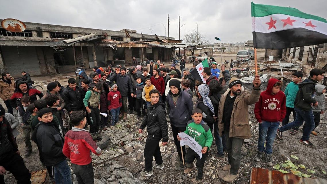 Syrians take part in a demonstration against the regime offensive in Syria’s last major opposition bastion of Idlib on January 17, 2020. (AFP)